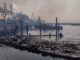 A burnt boat stands on the scorched waterfront as wildfires wreak havoc on the city of Lahaina in Maui, Hawaii. Image: Mason Jarvi via Reuters